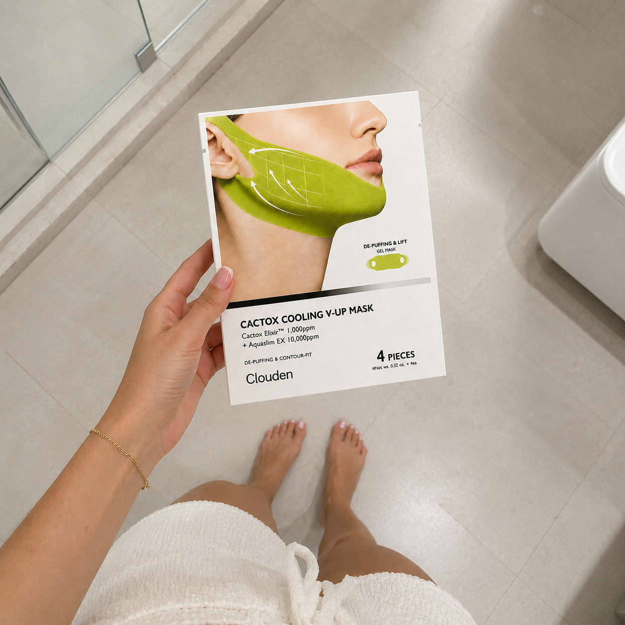 Sophie G. removing green jaw band in bathroom mirror